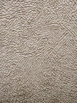 Macro Texture of Beige Embossed Wallpaper with Multi-Directional Pattern Stock Photos