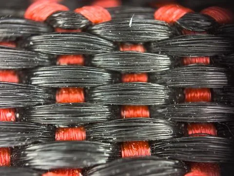 Macro texture of black and red fabric threads background with selective focus 스톡 사진
