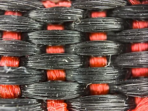 Macro texture of black and red fabric threads background with selective focus Stock Photos