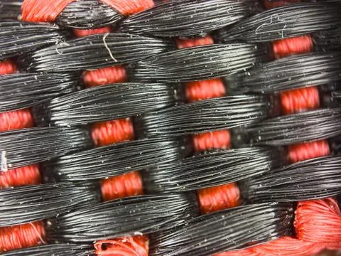 Macro texture of black and red fabric threads background with selective focus Stock Photos