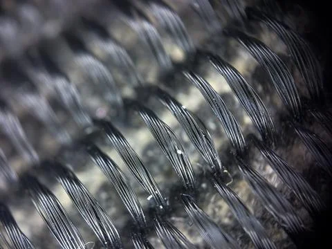 Macro texture of black fabric threads, close up background with selective focus Stock Photos
