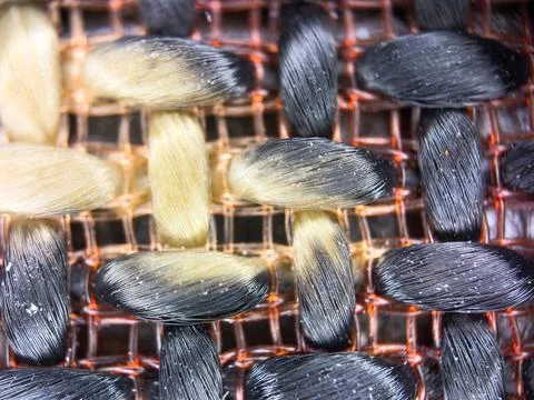 Macro texture of black fabric threads, close up background with selective focus Stock Photos