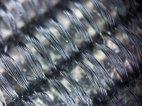 Macro texture of black fabric threads, close up background with selective focus Stock Photos