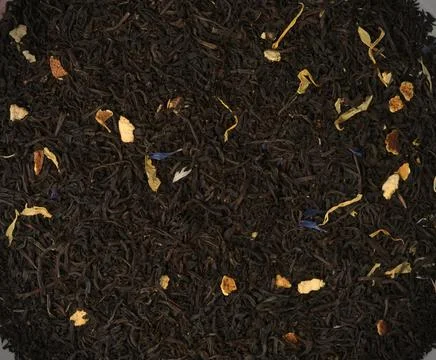 Macro texture of black tea with the addition of other ingredients. Stock Photos