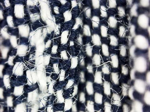 Macro texture of blue and white woven fabric threads background with selective Stock Photos