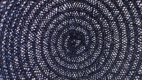 Macro texture of blue threads tied in a spiral between which there are white gap Stock Footage 142493571