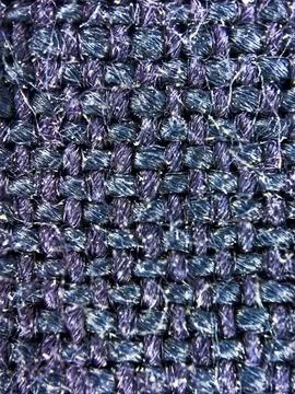 Macro texture of blue woven fabric threads background with selective focus and Stock Photos
