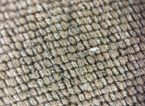 Macro texture of brown fabric threads background with selective focus and copy Stock Photos