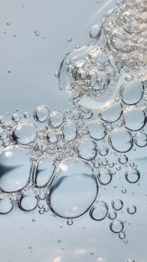 Macro texture of bubbles in blue liquid cosmetic serum. Stock Footage 329924728