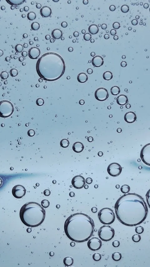 Macro texture of bubbles in blue liquid cosmetic serum. Stock Footage 329924733