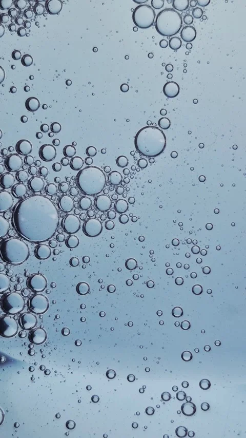 Macro texture of bubbles in blue liquid cosmetic serum. Stock Footage 329924737