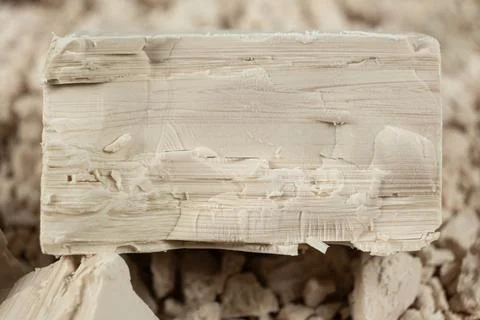 Macro texture of compressed fresh yeast cubes Stockfoto's