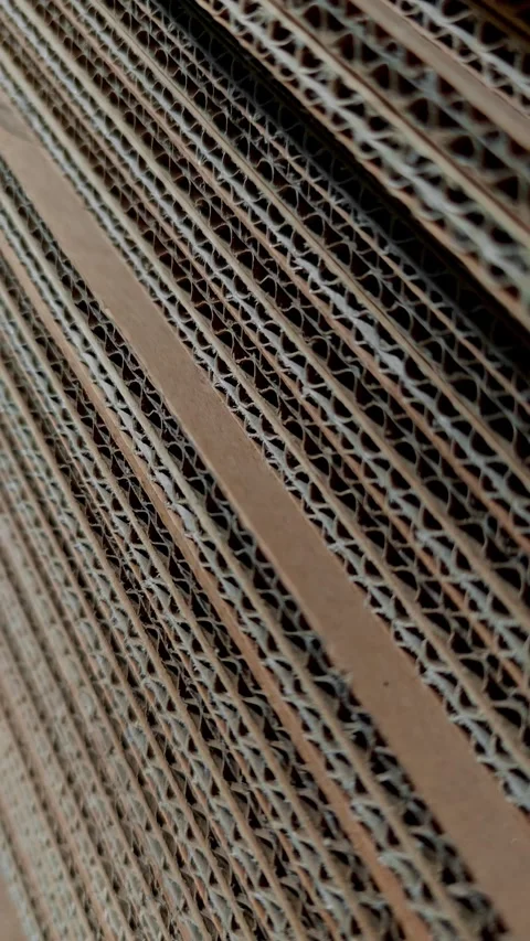 Macro texture of corrugated cardboard edges stacked in factory Stock Footage 346247939