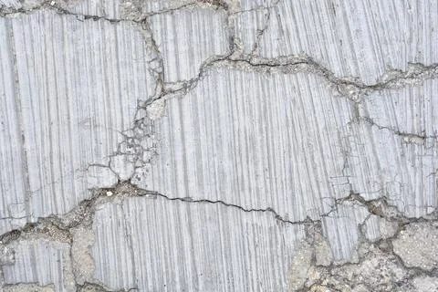 Macro texture of cracked concrete road pavement background variant Stock Photos