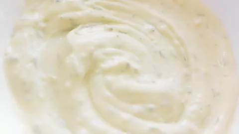 Macro texture of creamy herb dressing for fish burgers, 4K Stock Footage 341119614