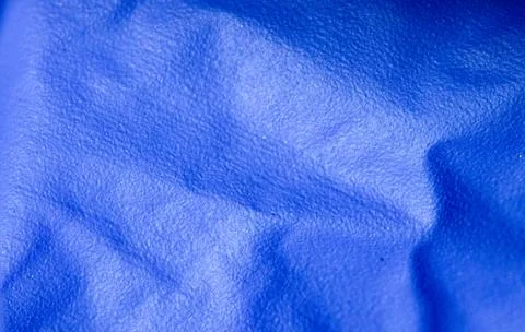 Macro Texture of Crumpled Blue Fabric with Soft Folds Stock Photos