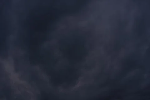 A macro texture of dense dark blue grey storm clouds. Stock Photos