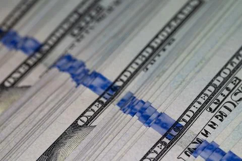 Macro texture of a dense stack of one hundred US dollar bills close-up Stock Photos