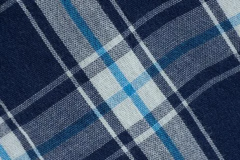 Macro texture of a fabric consisting of one hundred percent cotton. Stock Photos