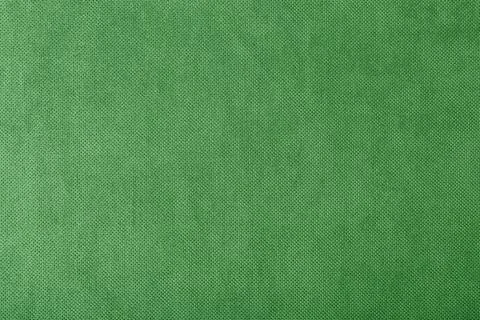 Macro texture fabric of large binding for sewing green background color Fotos de archivo