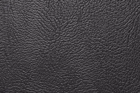 Macro texture fragment black leather wallpaper Stock Photos