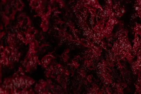 Macro Texture of Freshly Grated Red Beetroot with Deep Burgundy Color Foto stock