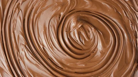 Macro texture of glossy chocolate nut cream swirling patterns Stock Footage 332237837