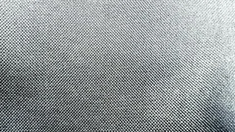 Macro texture of gray woven fabric showing detailed synthetic textile fibers  스톡 사진