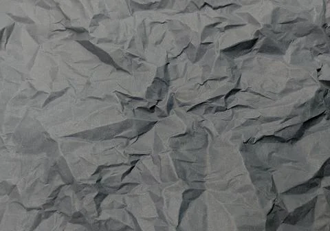 Macro Texture of Highly Crumpled Dark Grey Paper Surface Foto stock
