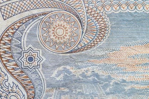 Macro texture of intricate guilloche patterns on Thai banknote Stock Photos