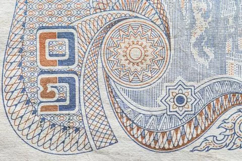 Macro texture of intricate guilloche patterns on Thai banknote Stock Photos