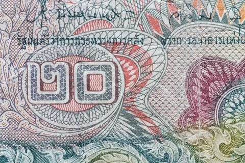 Macro texture of intricate guilloche patterns on Thai banknote Stock Photos