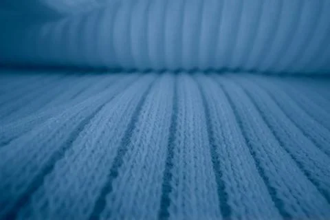 Macro texture of light blue knitted fabric with ribbed wave pattern 写真素材