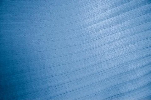 Macro texture of light blue knitted fabric with ribbed wave pattern Stock Photos