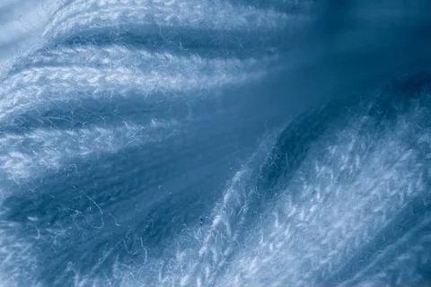 Macro texture of light blue knitted fabric with ribbed wave pattern Stock Photos