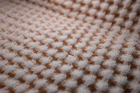 Macro texture of light orange fabric threads background with selective focus and 写真素材