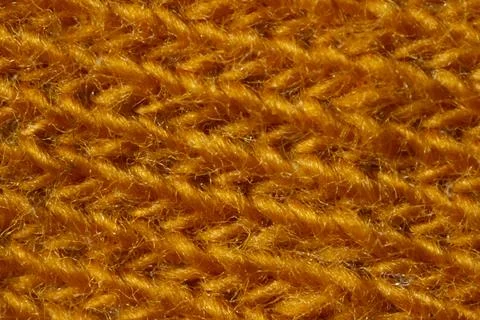 Macro Texture of machine knitting Fabric orange color. Stock Photos
