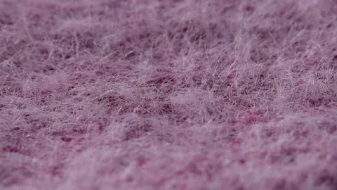 Macro texture of mink and cashmere wool fabric in pink color rotating, detailed Stock Footage 318004684
