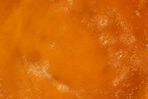 Macro texture of organic maple syrup with tiny air bubbles 스톡 사진
