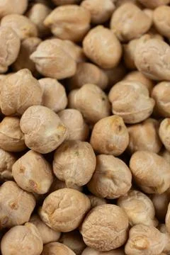 Macro texture of organic raw chickpea seeds. Stock Photos