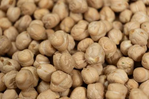 Macro texture of organic raw chickpea seeds. Stock Photos