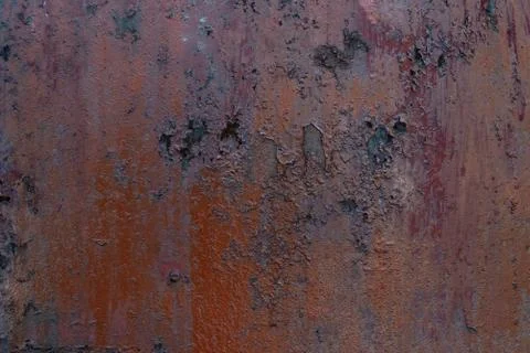 Macro texture of peeled paint on rusty iron closeup. Stock Photos