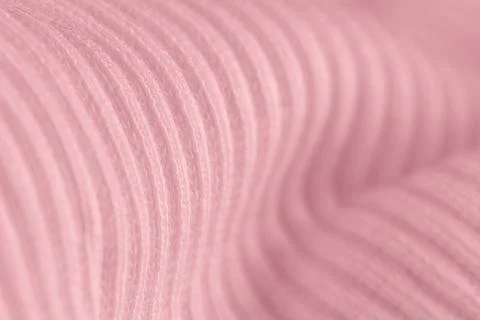 Macro texture of pink knitted wool fabric with ribbed pattern Stock Photos
