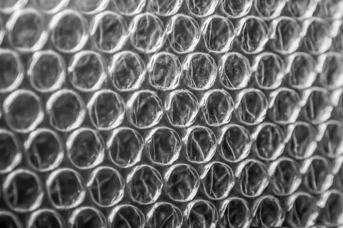 Macro texture of plastic bubble wrap packaging material. Stock Photos