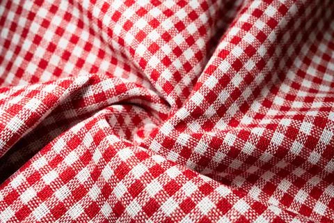 Macro texture of red and white fabric threads background with selective focus Stockfoto's