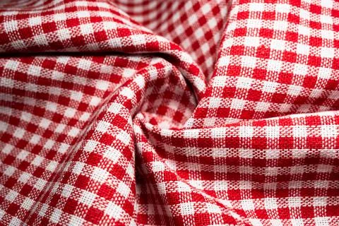 Macro texture of red and white fabric threads background with selective focus Stock Photos