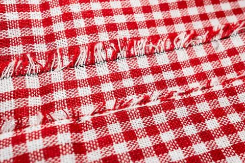 Macro texture of red and white fabric threads background with selective focus Stock Photos