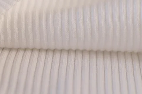Macro Texture of Ribbed Knit Fabric. Cloud Dancer 11-4201. Foto stock