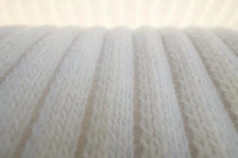 Macro Texture of Ribbed Knit Fabric. Cloud Dancer 11-4201. 스톡 사진