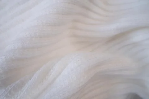 Macro Texture of Ribbed Knit Fabric. Cloud Dancer 11-4201. 스톡 사진